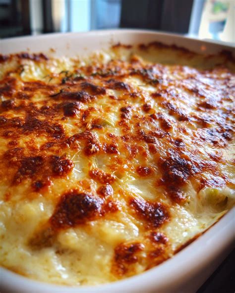 Close-up of golden brown gratin pasta with cheese and pancetta