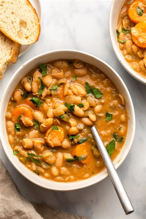 Bowl of white bean stew with fresh herbs