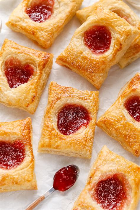 Thematic photo of an almond roll with sour cream and jam