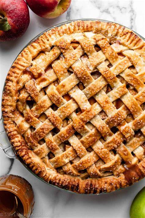 Close-up photo of cooked apples being spread over a pie crust
