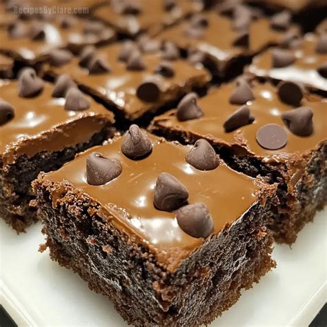 Image of rich, fudgy chickpea squares, possibly with chocolate chips visible, served on a plate.
