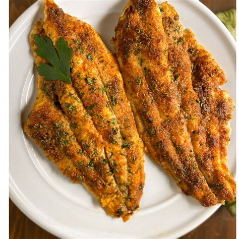 Thematic photo of a baked catfish fillet on a plate