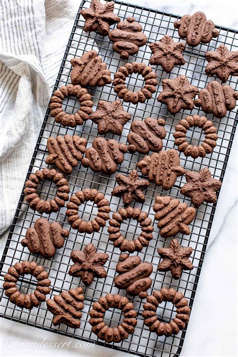 Thematic photo of chocolate spritz cookies (wreaths) on a festive table