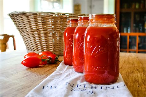 Canned homemade tomato sauce in glass jars