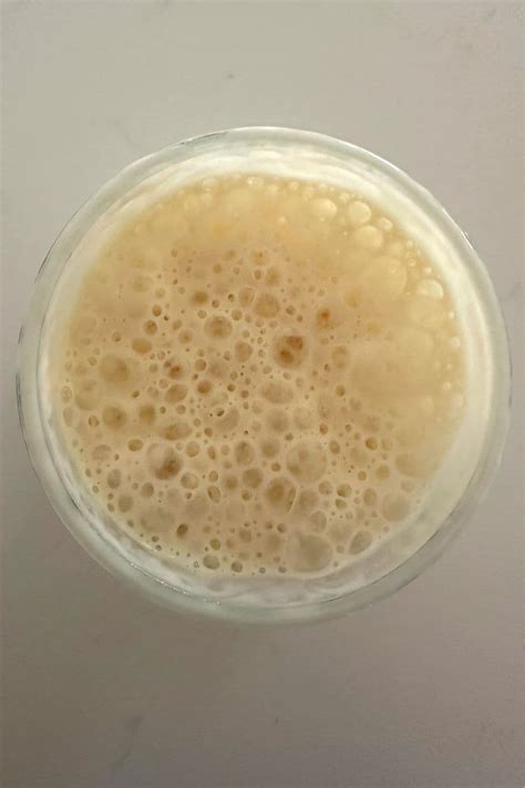Close-up photo of active sourdough starter with bubbles