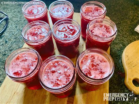 Photo showing sterile jars being filled with hot jam.