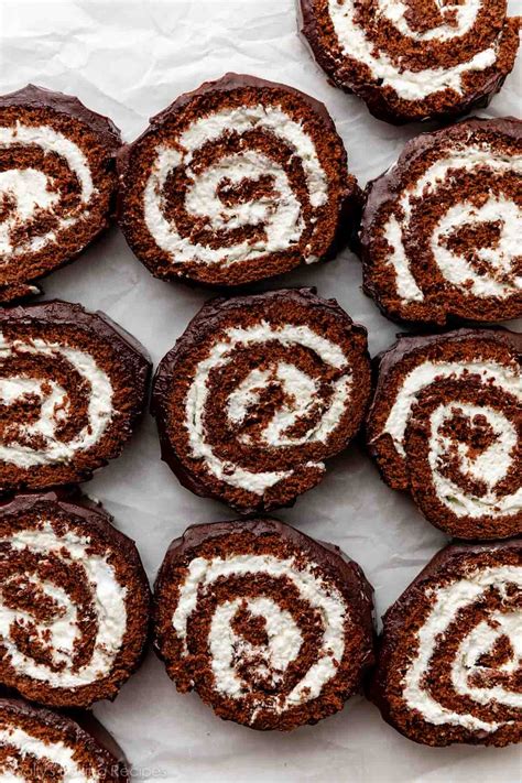 Thematic photo of a slice of chocolate roll with cream filling and a cup of coffee