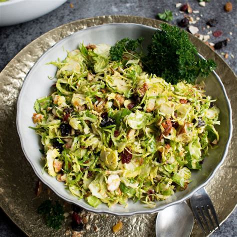 Thematic photo of a salad with raw Brussels sprouts, prosciutto, and almonds