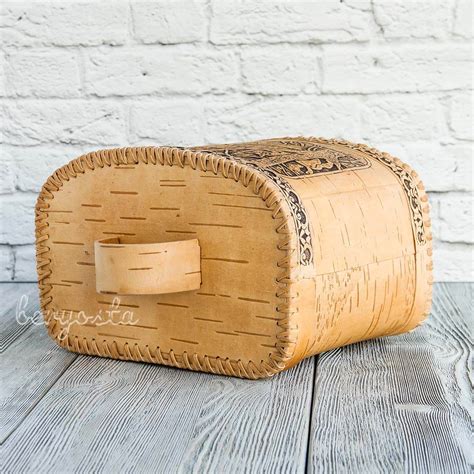 Artisanal birch bark bread bin with traditional decorative patterns