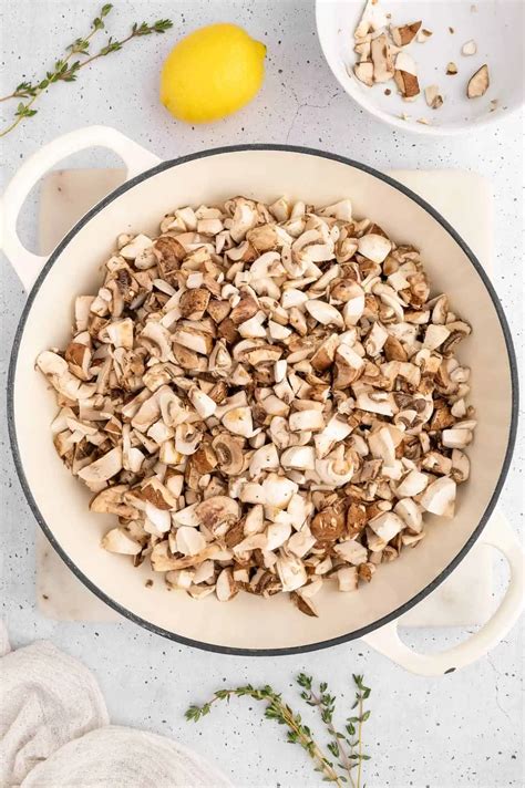 chopped mushrooms and herbs in a pan for filling