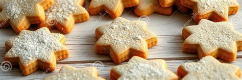 A beautifully arranged group of orange star cookies, some dusted with powdered sugar