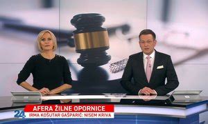 Slika: žilne opornice in roke, ki pregledujejo dokumente (korupcija)