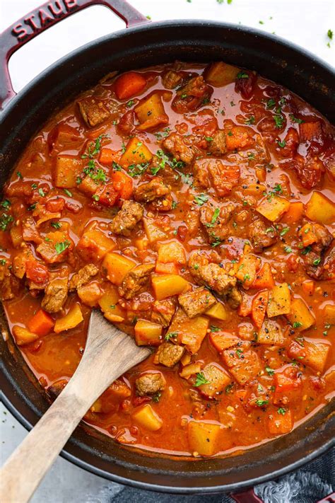 Thematic photo of a rustic kitchen with a pot of potato goulash on the stove