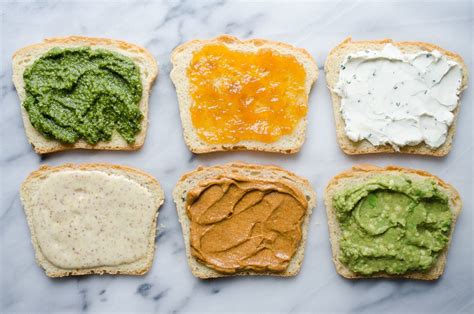 Thematic photo of various homemade spreads on bread.