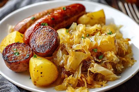 Photo of a hearty plate of stewed sauerkraut with potato and sausage