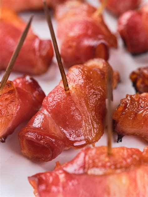 Thematic photo of meat rolls wrapped in bacon and secured with toothpicks