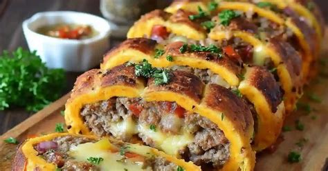 Thematic photo of a potato roulade with minced meat and spinach