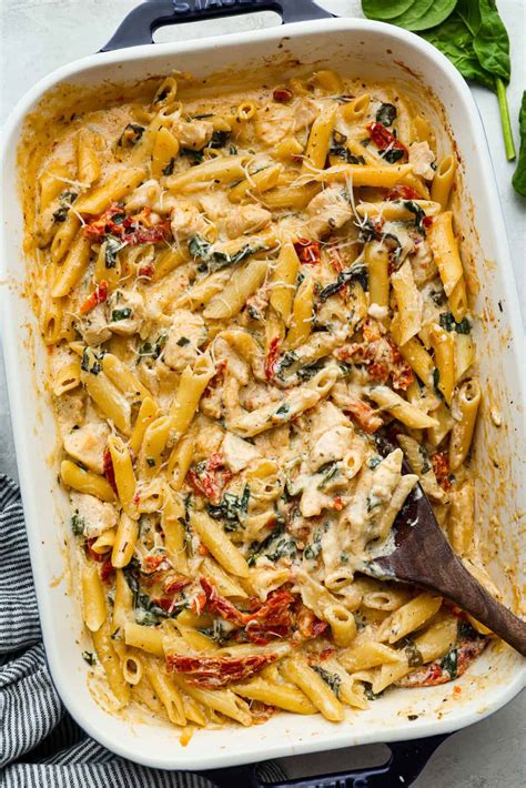 Thematic photo of a baked chicken and pasta dish with melted cheese
