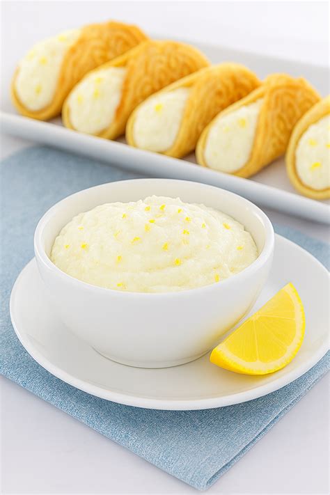 The image should show a bowl of ricotta cheese filling, possibly with lemon zest and vanilla visible.