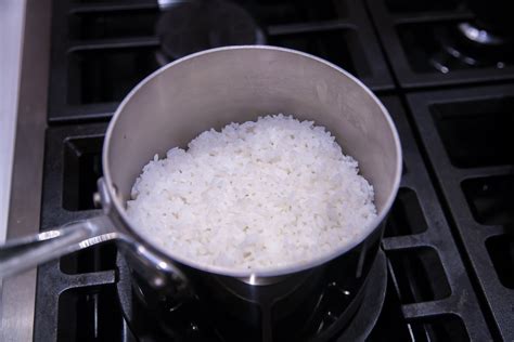 Thematic photo of cooking rice in a pot
