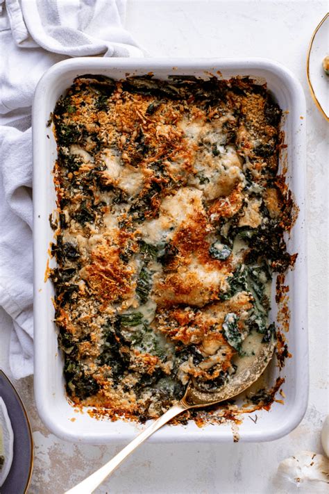 Layered kale and cheese gratin in a baking dish
