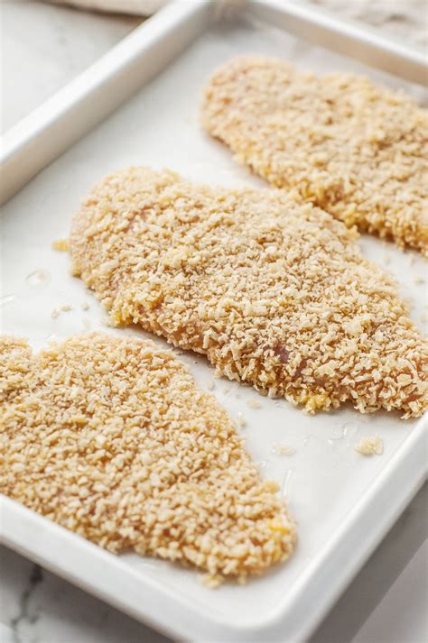 Photo of breaded chicken fillets ready for baking
