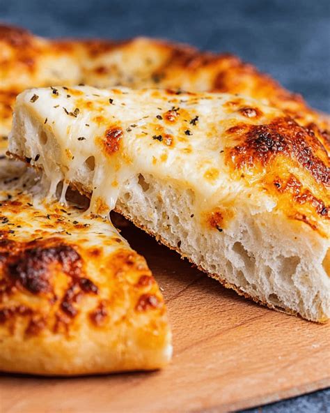 Thematic photo of a baked sourdough pizza with a golden crust