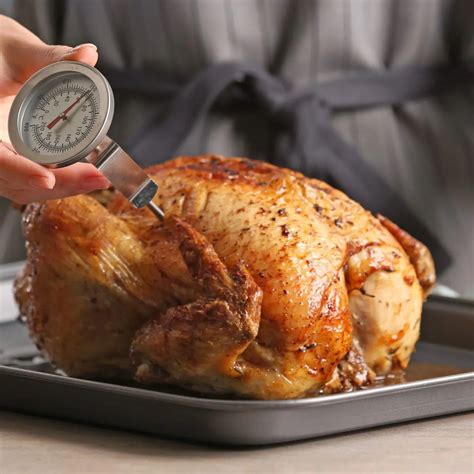 Kitchen thermometer inserted into a roast to check the internal temperature