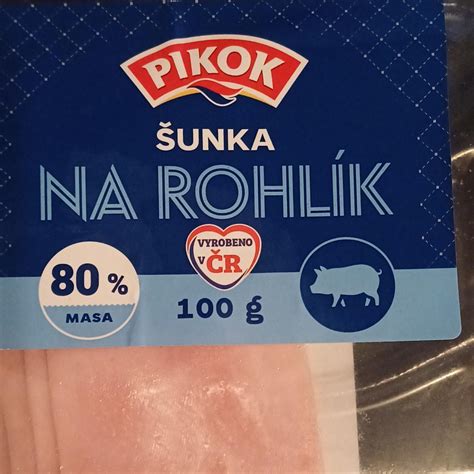 Tematska fotografija: Šunka v želatini, narezana na rezine s pogledom na plasti mesa in zelenjave