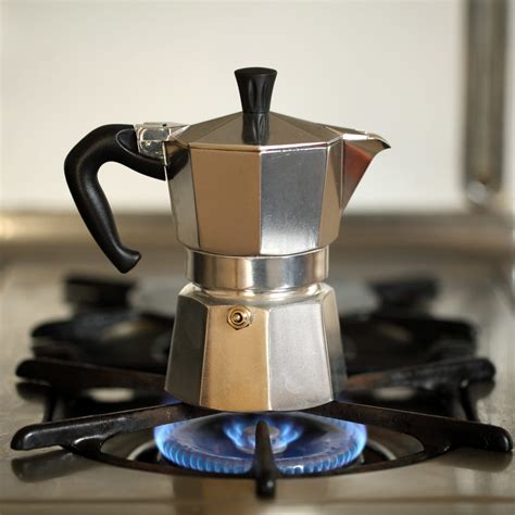 Thematic photo of a moka pot or cezve on a cooking plate