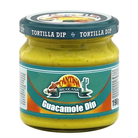 Pripravljena omaka guacamole v skledi, obdana z nacho čipsi.