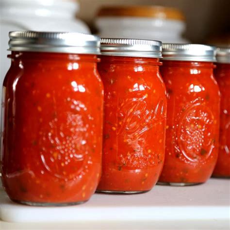 Photo of a homemade tomato sauce in jars ready for storage