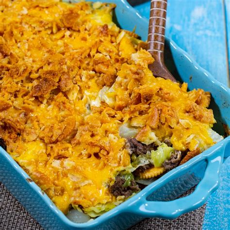 Photo of a layered casserole with minced meat, rice, and cabbage before baking.
