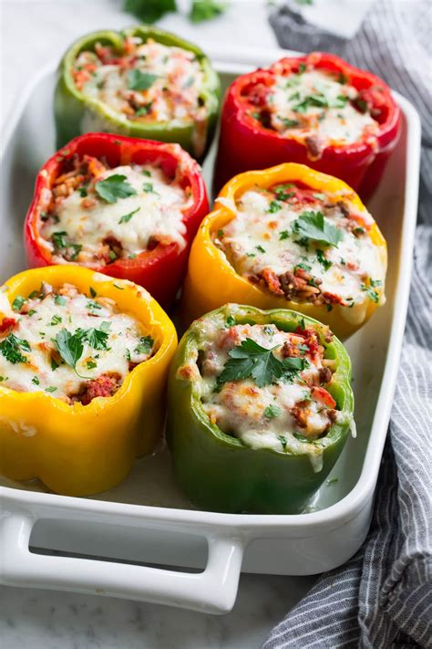 Photo of baked stuffed peppers with sauce