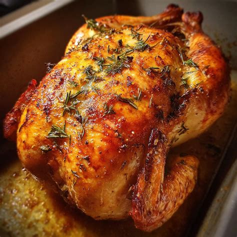 Photo of a whole chicken baking on a bed of coarse salt