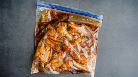 Photo of meat marinating in a plastic bag in a refrigerator