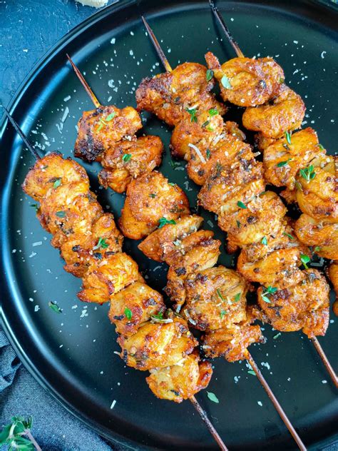 Close-up photo of chicken skewers being carved after baking