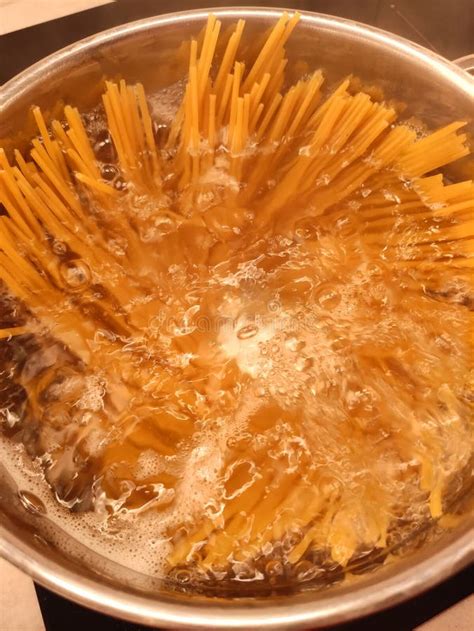 Photo of cmoki being shaped with fruit filling and then cooked in boiling water