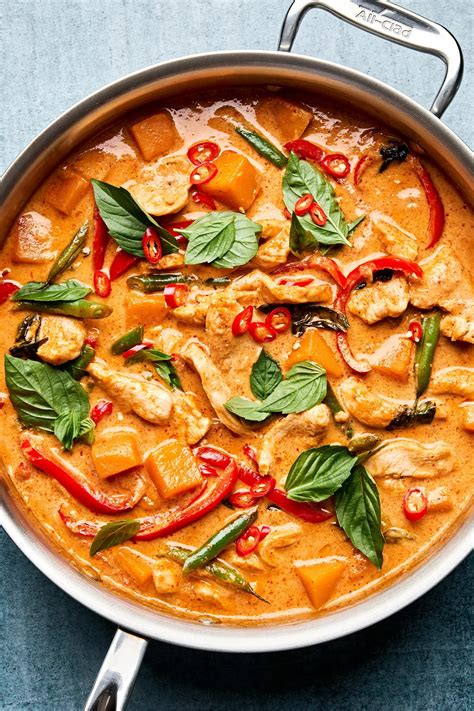 A vibrantly colored and aromatic Red Curry dish served with rice.