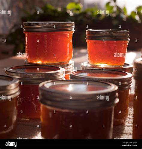 photo of freshly made orange marmalade in jars