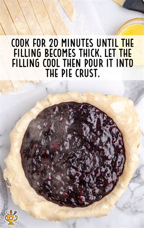 Photo of a blueberry filling being spread on a crust