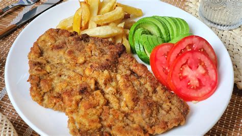 Photo of a breaded steak filled with prosciutto and cheese