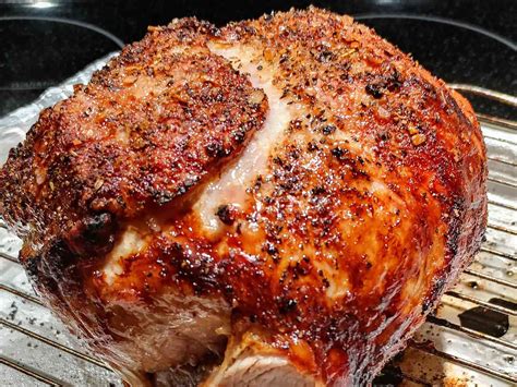 Thematic photo of a perfectly roasted pork roast with a crispy crust