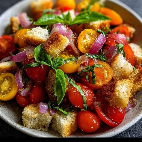 Thematic photo of a panzanella salad in a rustic bowl