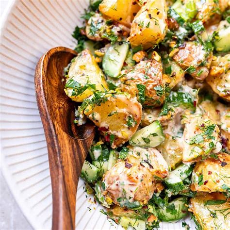 Thematic photo of a colorful roasted potato salad in a bowl