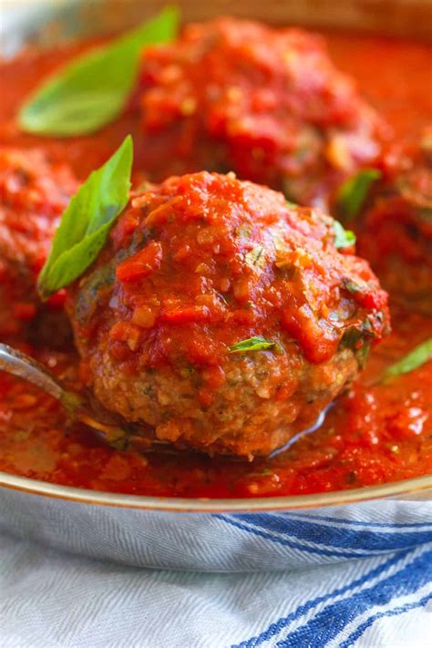 Thematic photo of juicy meatballs without eggs in tomato sauce