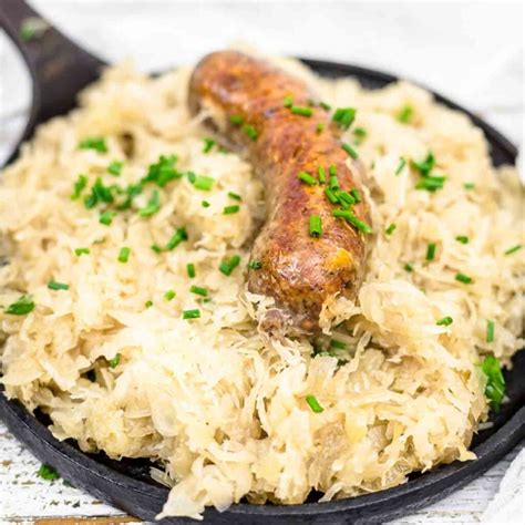 Photo of a baked dish with sauerkraut and various meats