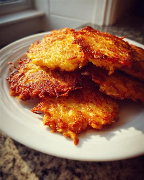 Thematic photo of golden brown fried potato fritters on a plate
