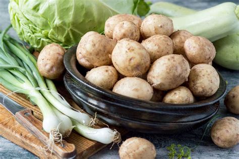 Thematic photo of fresh zucchini and young potatoes