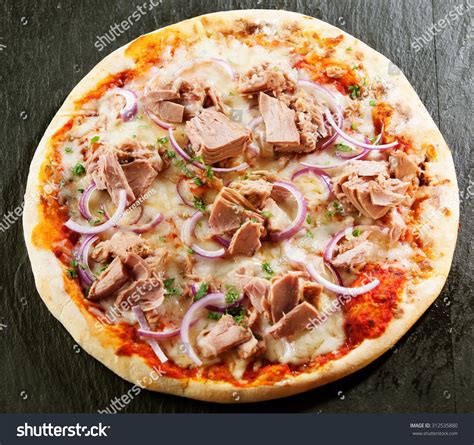 Photo of a tuna pizza with mozzarella and gorgonzola